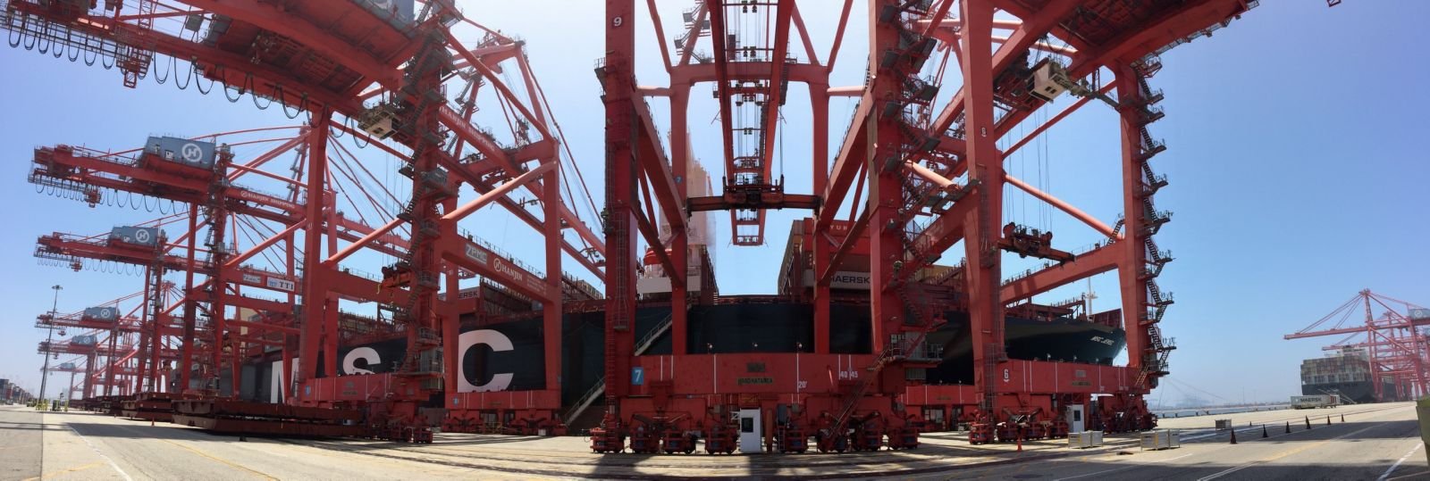 Cranes at the Port of LA Long Beach alongside a ship
