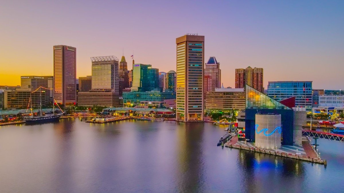 The distinctive skyline of Baltimore's Inner Harbor rises above the water.